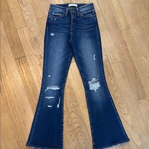 Blue Flare Wide Leg Jeans with Distressing and Fading
